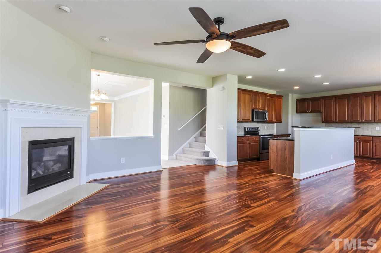 187 Solheim Lane Raleigh, NC 27603 - Photo 3 of 25 a view of kitchen with cabinets and wooden floor