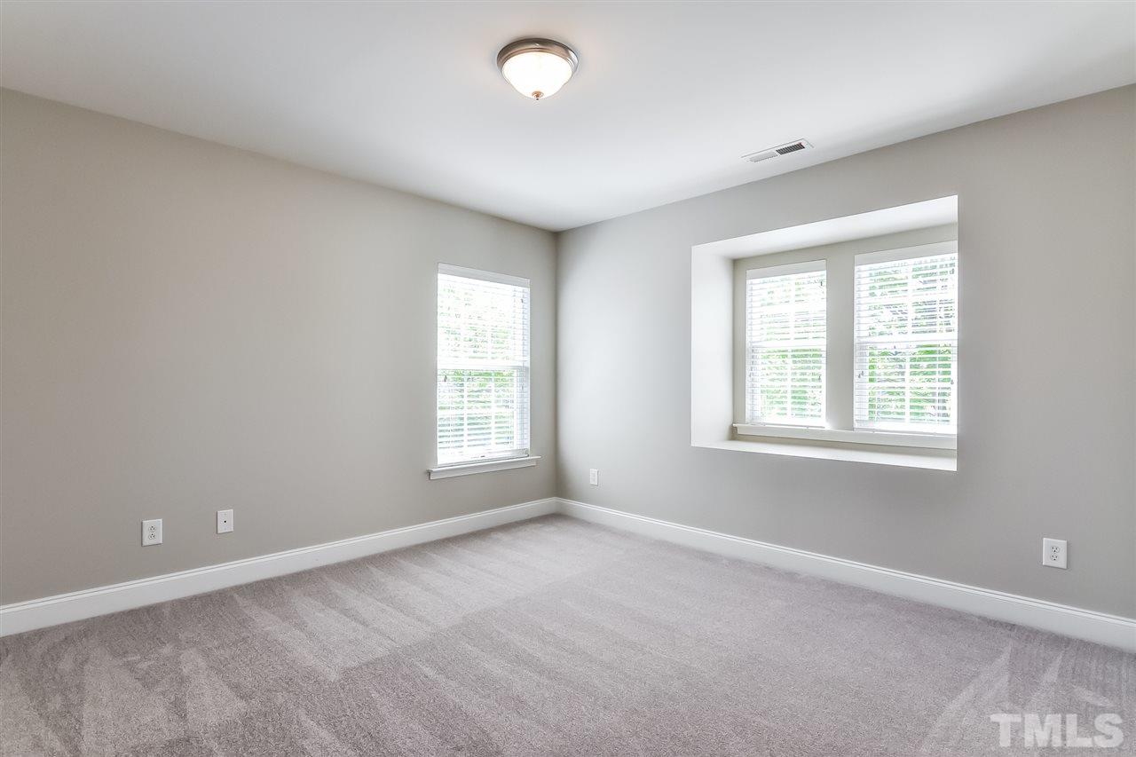 187 Solheim Lane Raleigh, NC 27603 - Photo 21 of 25 an empty room with a window