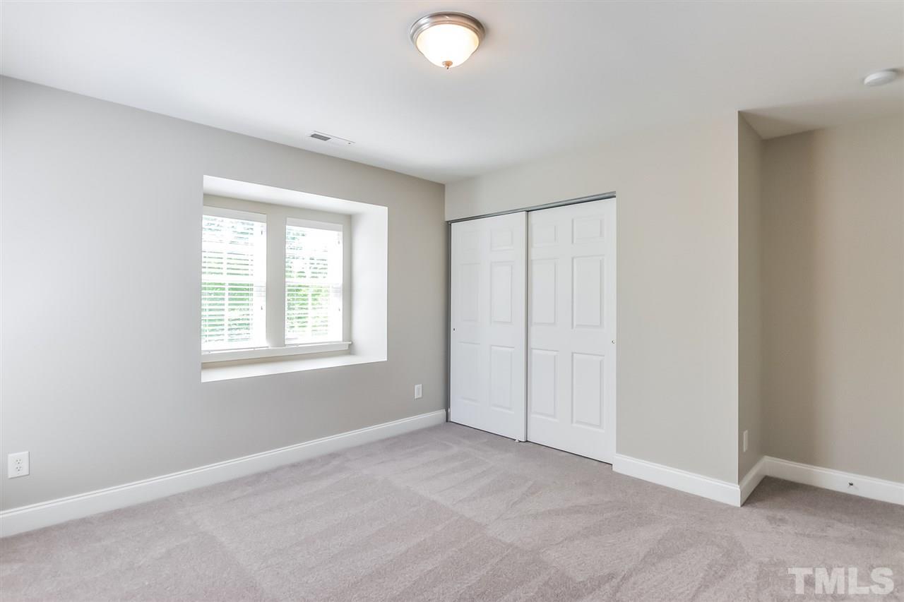 187 Solheim Lane Raleigh, NC 27603 - Photo 22 of 25 an empty room with windows and closet