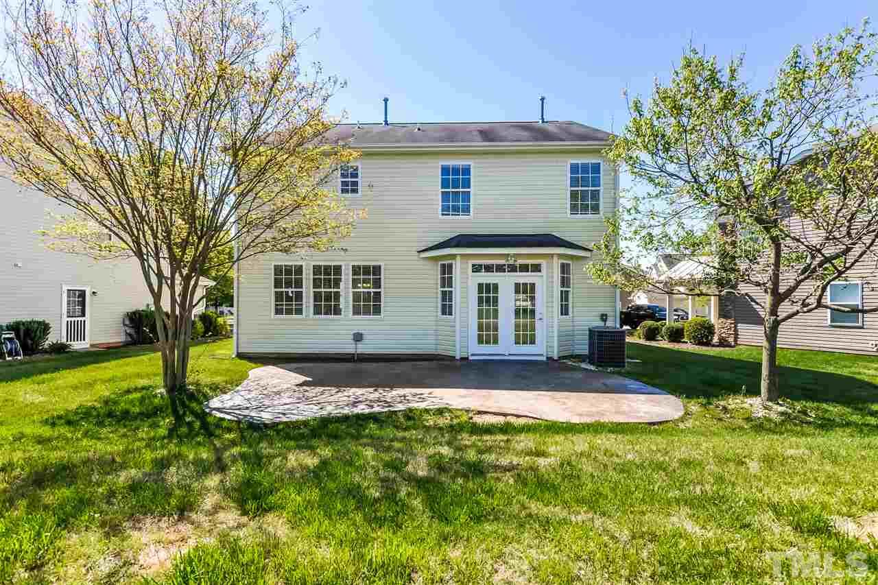 187 Solheim Lane Raleigh, NC 27603 - Photo 5 of 25 a view of a house with backyard and tree