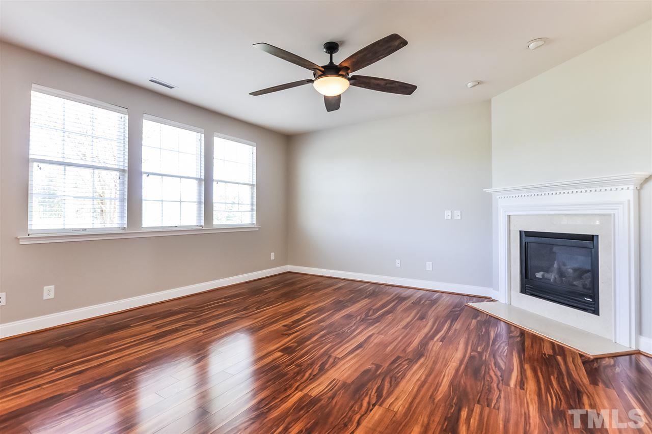 187 Solheim Lane Raleigh, NC 27603 - Photo 8 of 25 wooden floor in an empty room with a window