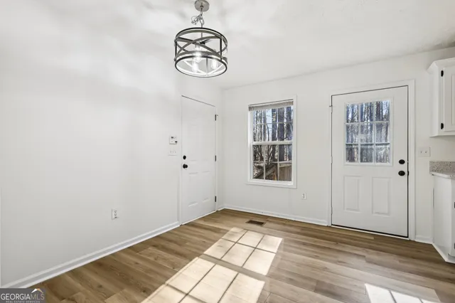 a view of empty room with windows