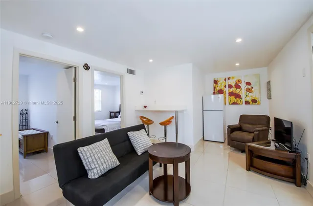 a living room with furniture and a couch