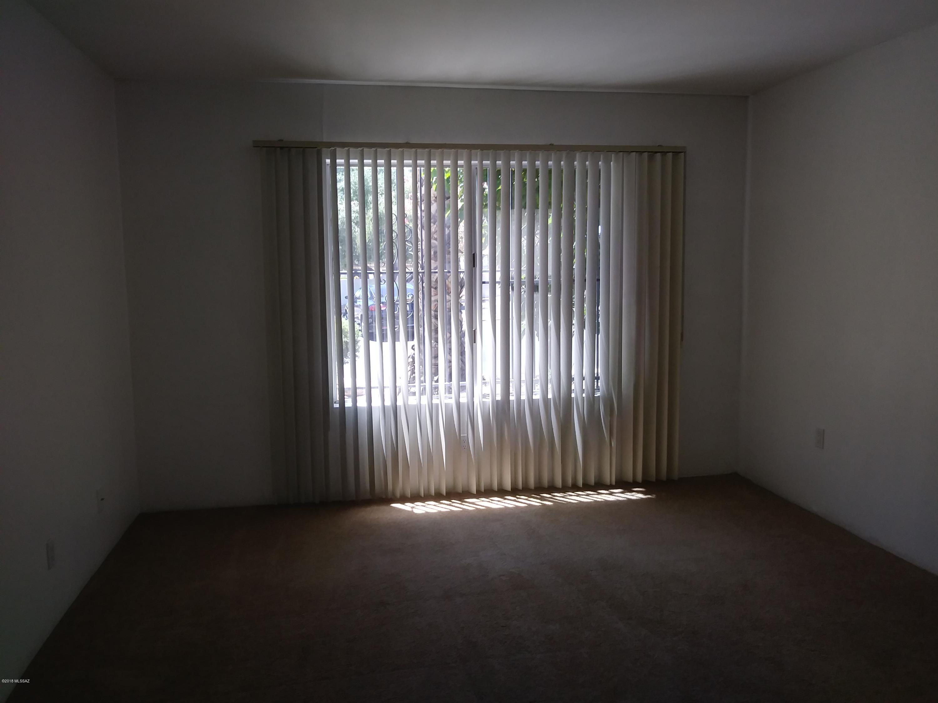 600 East River Road, Unit 1 Tucson, AZ 85704 - Photo 13 of 21 an empty room with a window