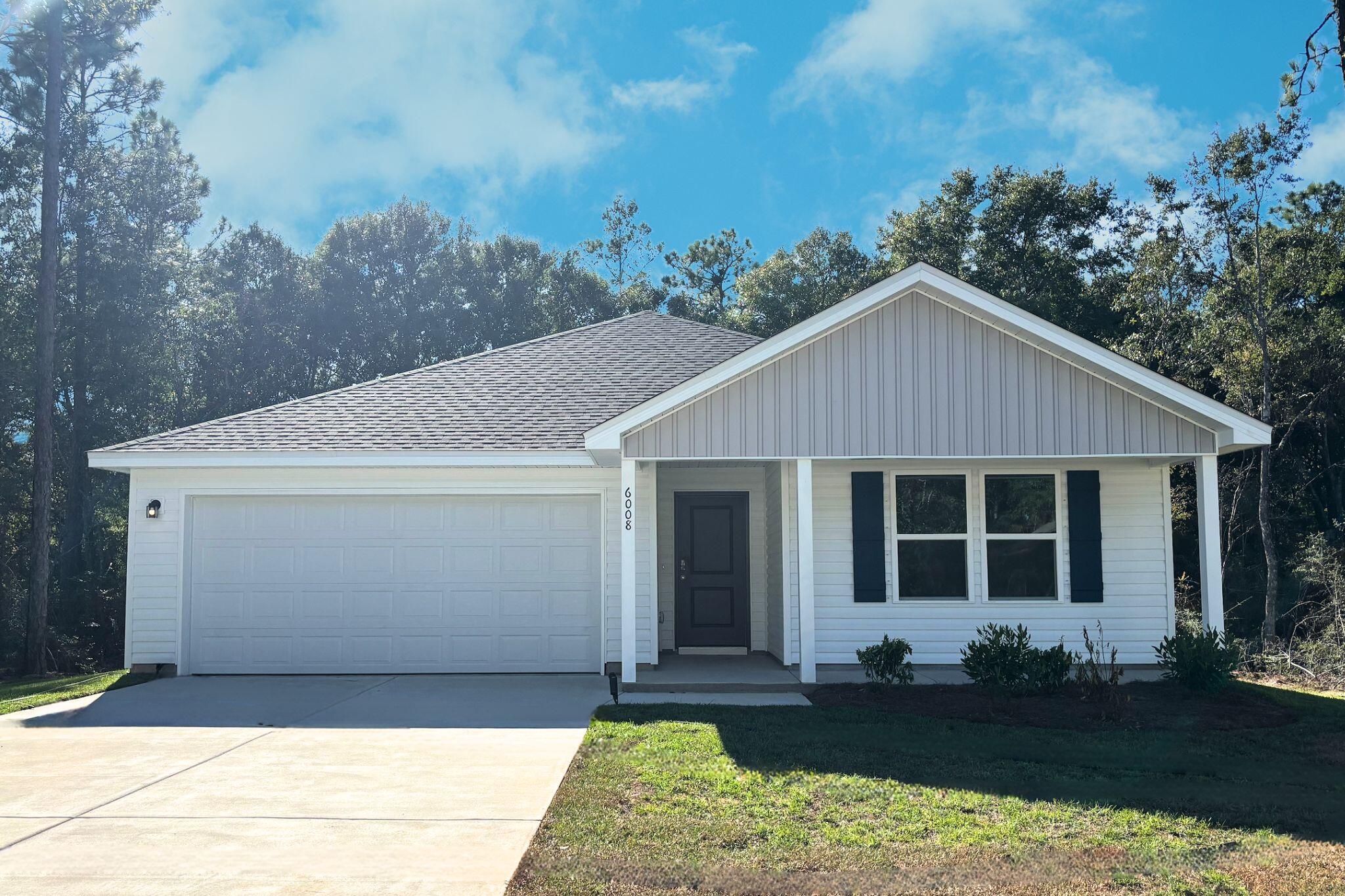 6008 Hidden Knoll Crestview, FL 32539 - Photo 1 of 28 a front view of a house with a garden