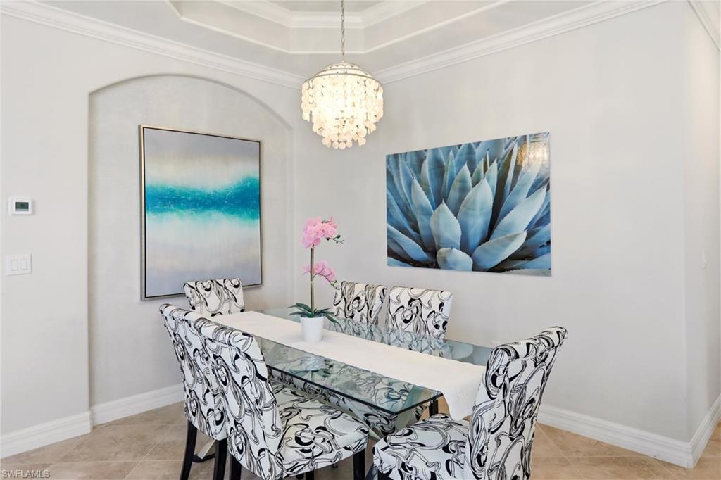 9238 Veneto Place, Unit 35 Naples, FL 34113 - Photo 17 of 49 a view of a dining room with furniture