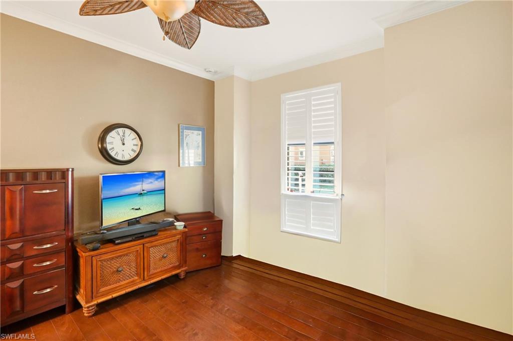 9238 Veneto Place, Unit 35 Naples, FL 34113 - Photo 19 of 49 a living room with furniture and a flat screen tv