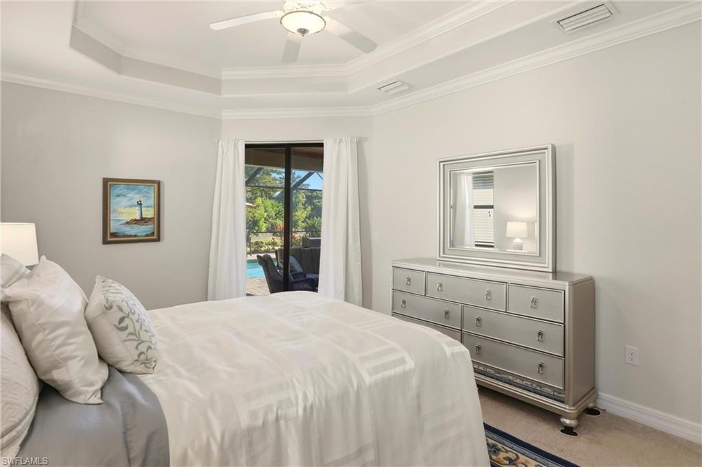 9238 Veneto Place, Unit 35 Naples, FL 34113 - Photo 22 of 49 a bedroom with a bed and a window