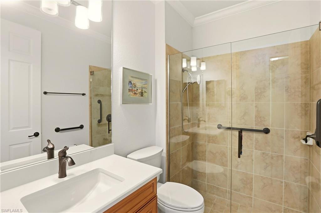 9238 Veneto Place, Unit 35 Naples, FL 34113 - Photo 30 of 49 a bathroom with a sink toilet and shower