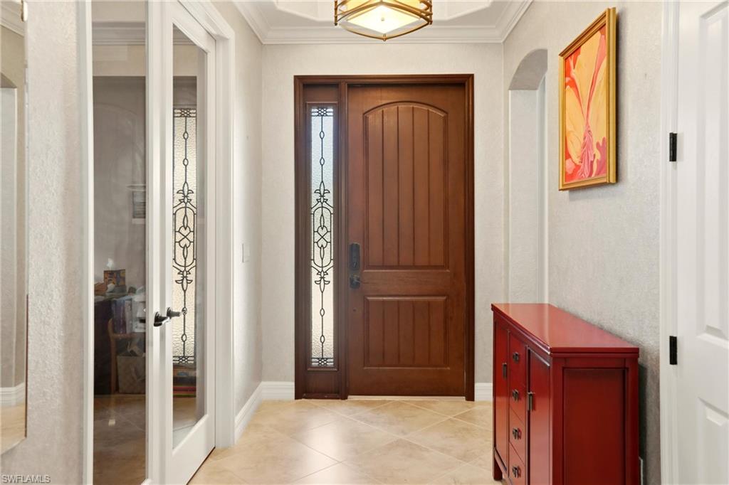 9238 Veneto Place, Unit 35 Naples, FL 34113 - Photo 3 of 49 a view of front door with a mirror