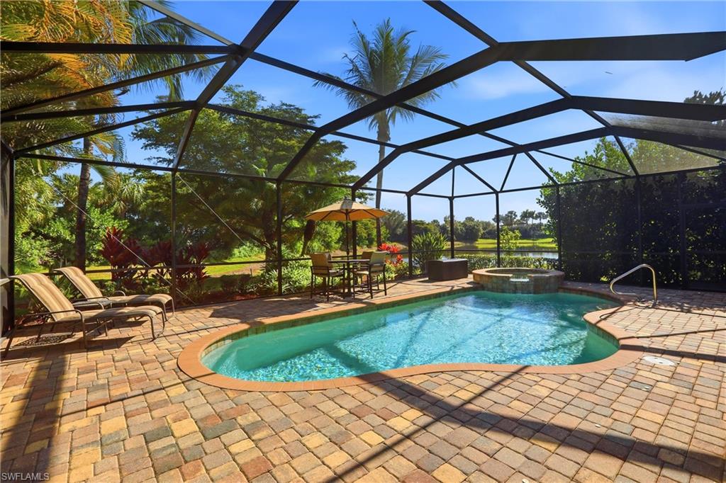 9238 Veneto Place, Unit 35 Naples, FL 34113 - Photo 39 of 49 a view of a swimming pool with a patio