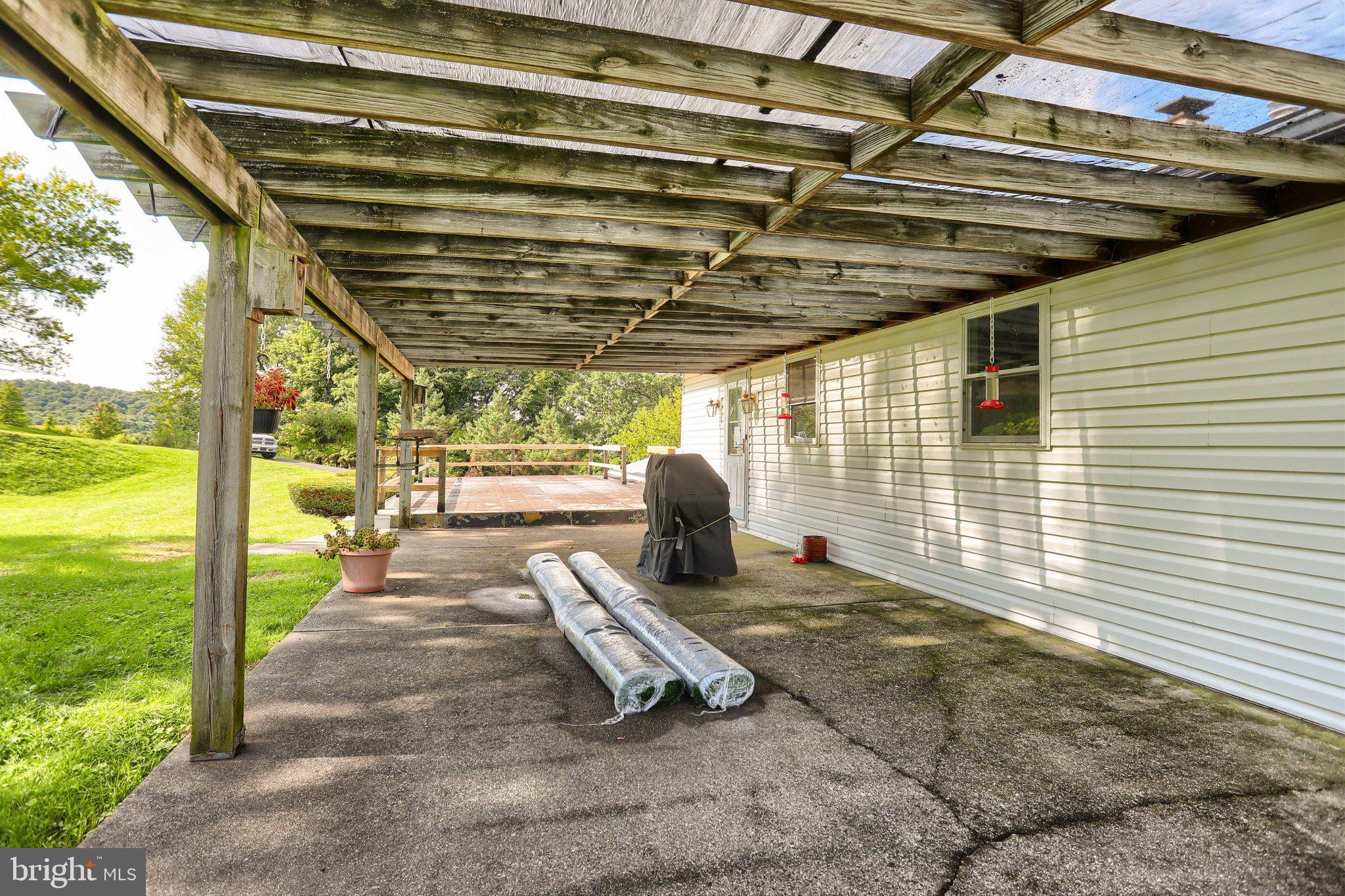 7620 Spring Road New Bloomfield, PA 17068 - Photo 37 of 49 REAR COVERED PORCH