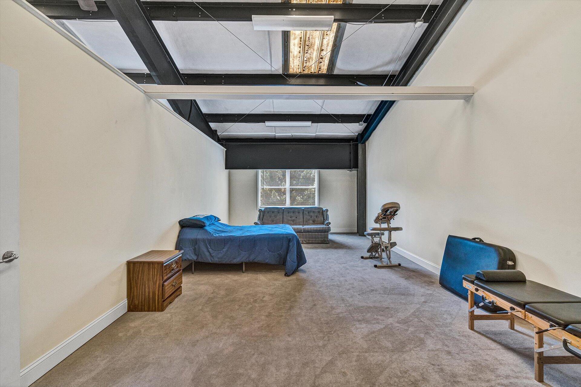2446 Deer Run Road Ferrum, VA 24088 - Photo 84 of 144 a living room with furniture and a window