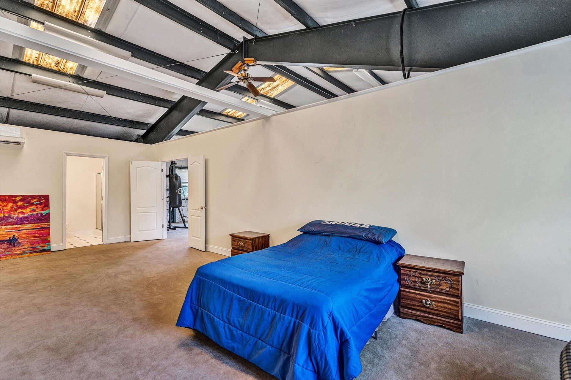 2446 Deer Run Road Ferrum, VA 24088 - Photo 85 of 144 a bedroom with a bed and a ceiling fan