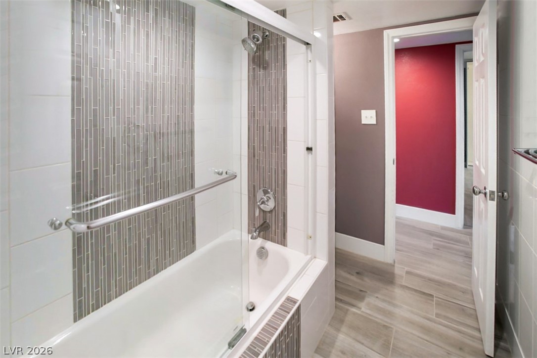 228 Redstone Street Las Vegas, NV 89145 - Photo 22 of 31 Full bath featuring tiled shower / bath combo and baseboards
