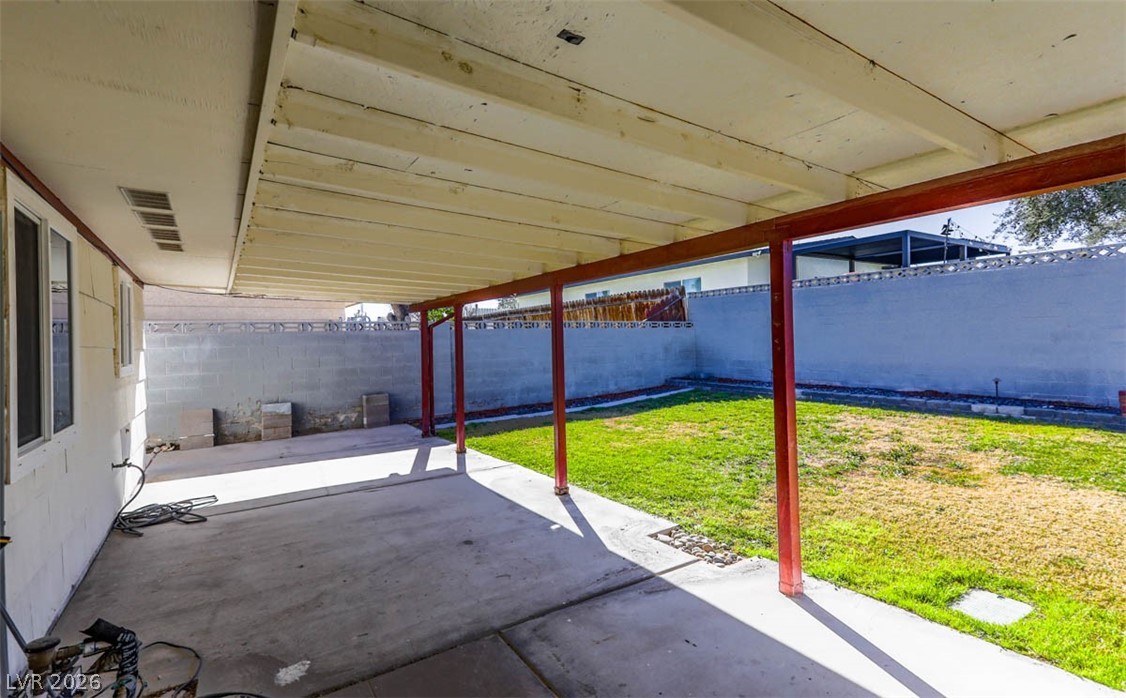 228 Redstone Street Las Vegas, NV 89145 - Photo 26 of 31 Fenced backyard with a patio