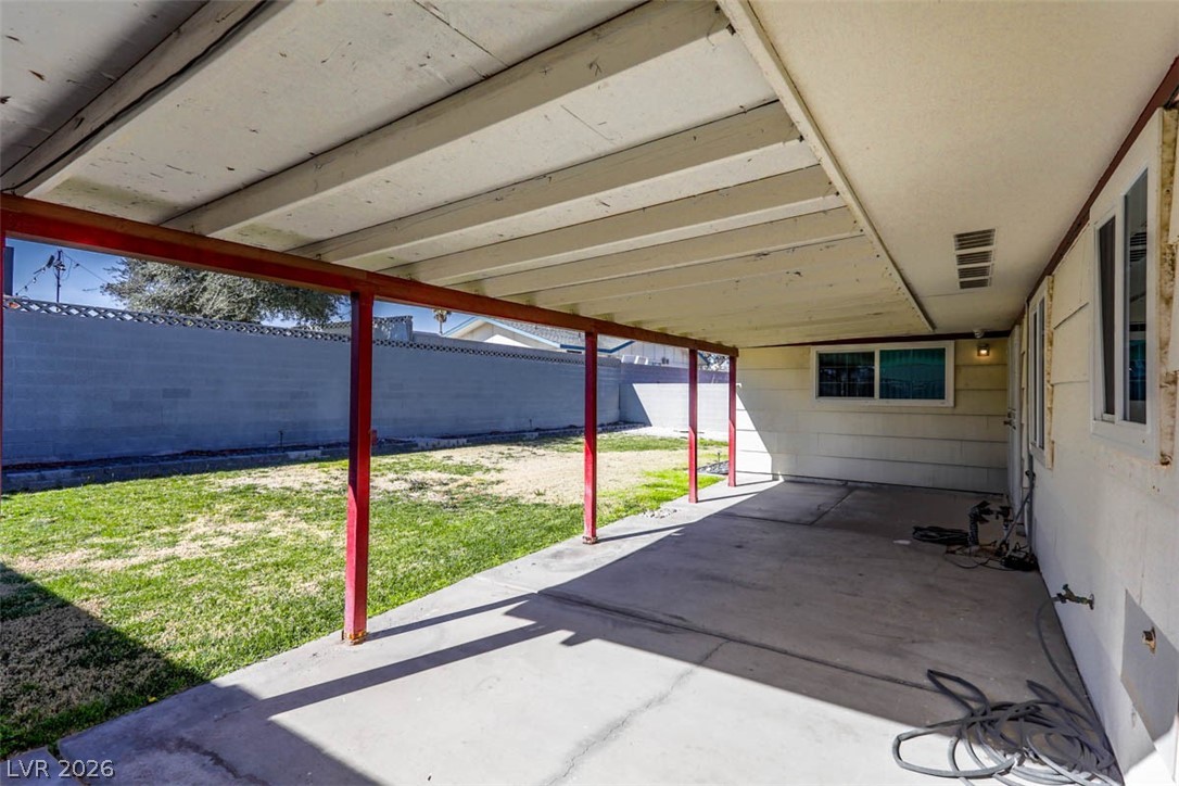 228 Redstone Street Las Vegas, NV 89145 - Photo 27 of 31 Fenced backyard with a patio