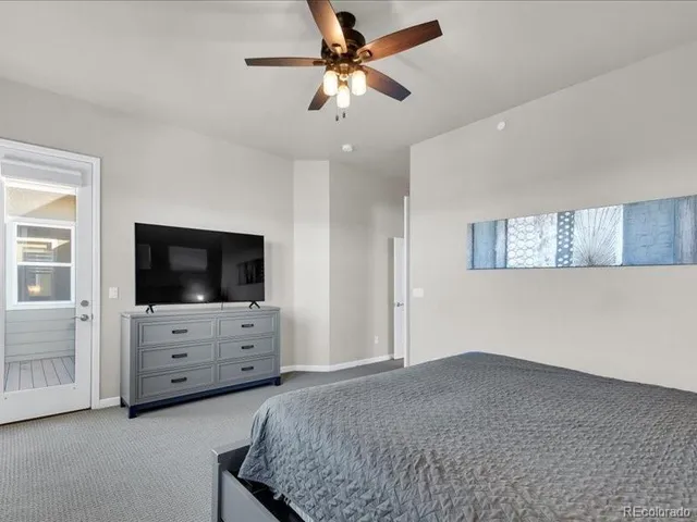 a bathroom with a double vanity sink a mirror and a bathtub