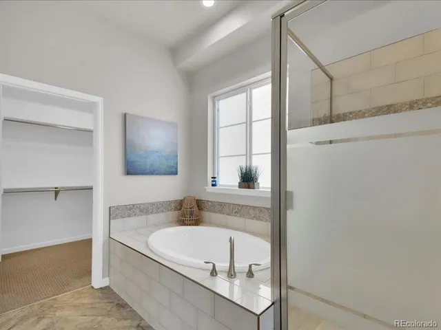 a bathroom with a bathtub and a sink