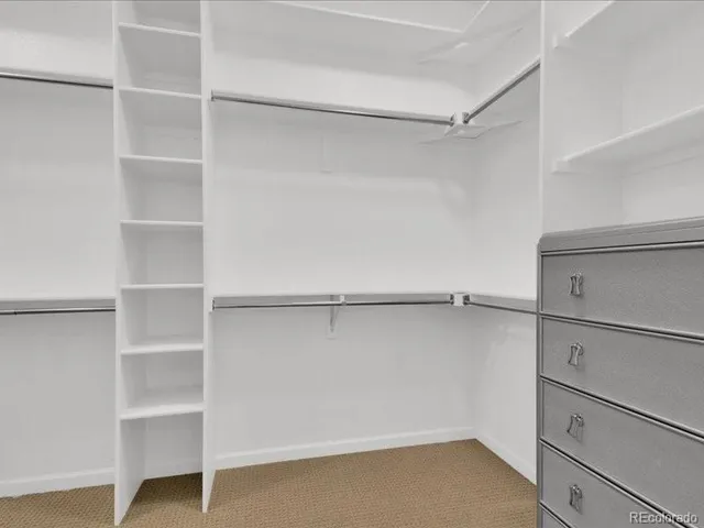 a view of an empty walk in closet