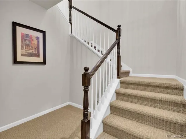 a view of a livingroom with a staircase