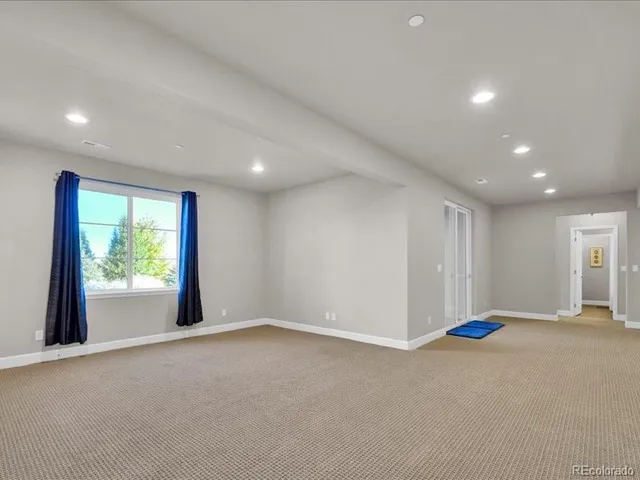 a view of empty room with a fireplace