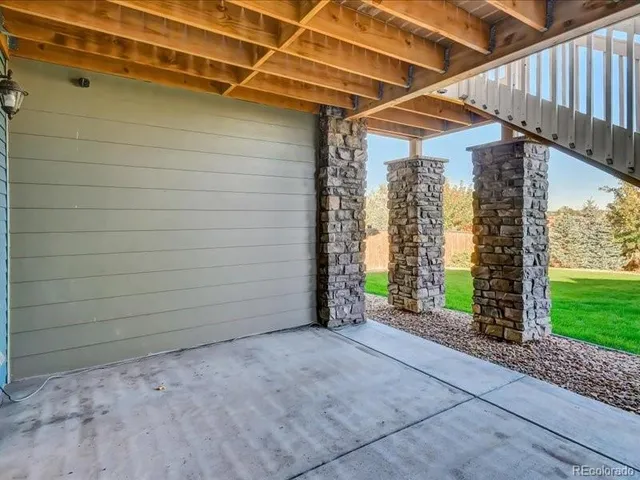 a view of a city with tall buildings and a big yard