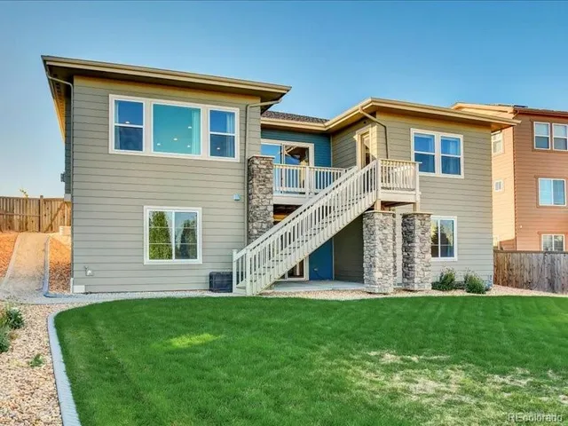 a view of a house with outdoor space and sitting area