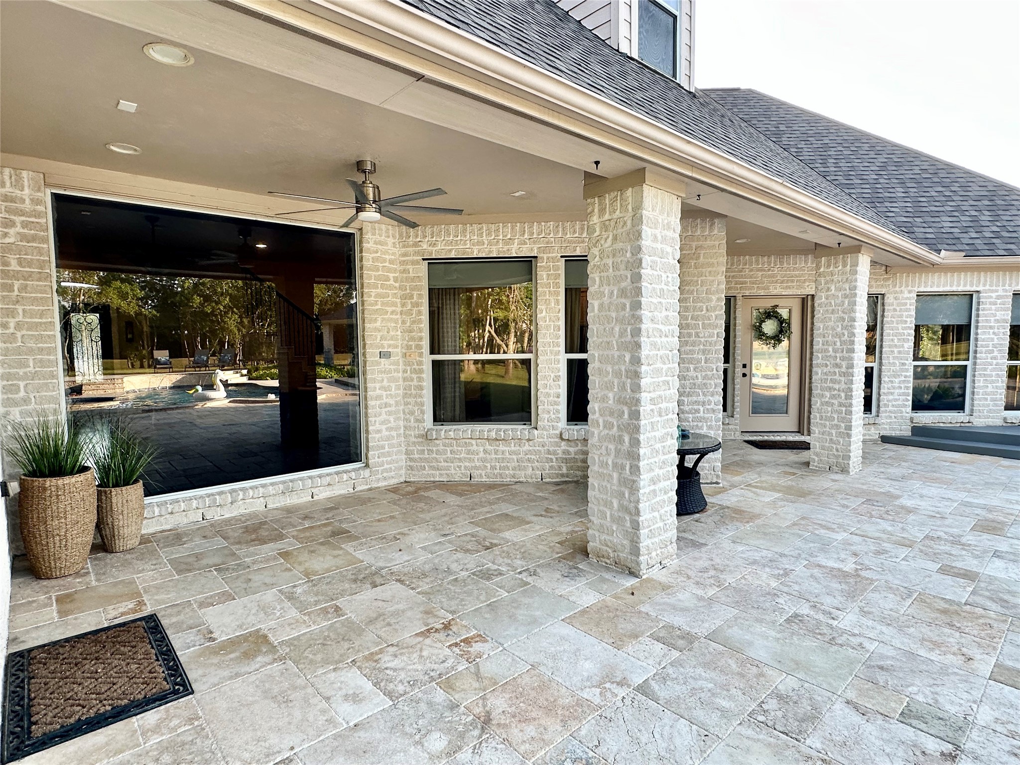 2904 Bridle Path Lane Friendswood, TX 77546 - Photo 40 of 49 The back of the home features multiple sitting areas and endless possibilities—ready for you to design your ideal outdoor retreat, whether for relaxing, entertaining, or soaking in the peaceful views.