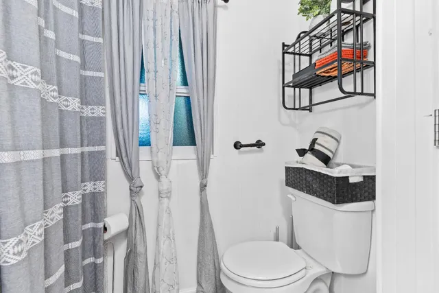 a bathroom with a toilet and a sink