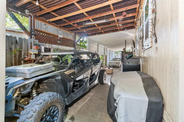 a view of a house with potted plants