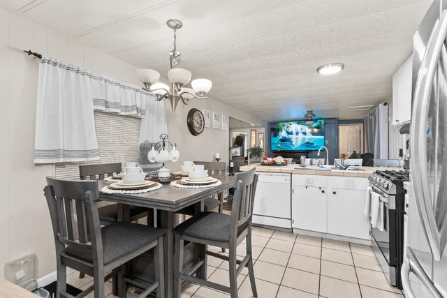 a kitchen with a table and chairs in it