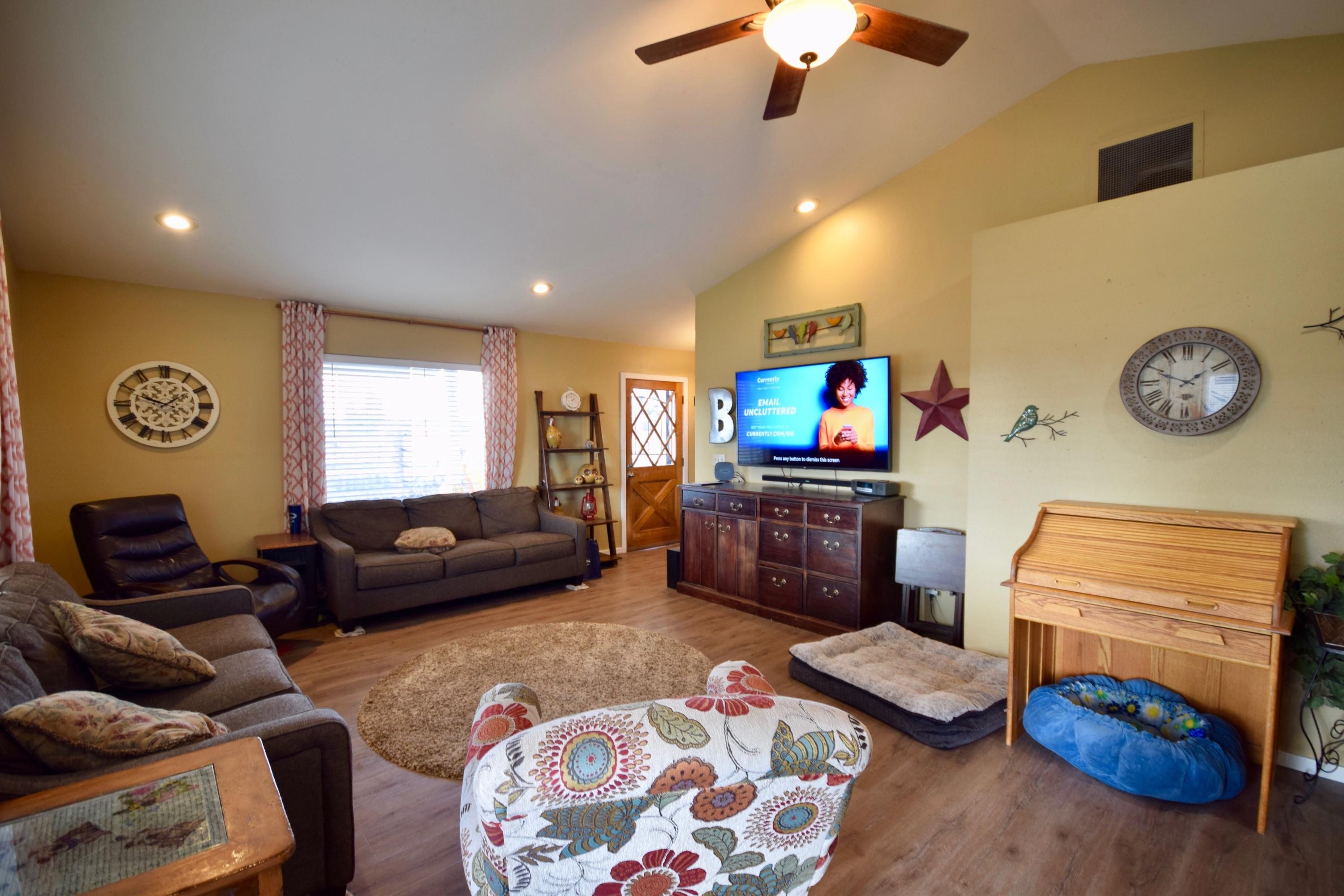 22169 Nelson Road Bend, OR 97701 - Photo 12 of 42 a living room with furniture and a flat screen tv