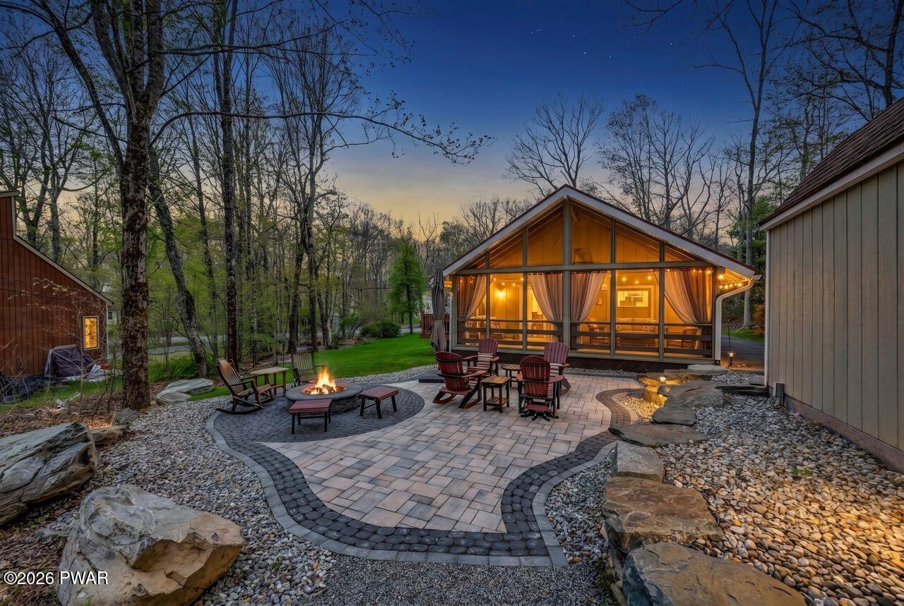 103 Forest Drive Hawley, PA 18428 - Photo 5 of 85 a backyard of a house with barbeque oven table and chairs