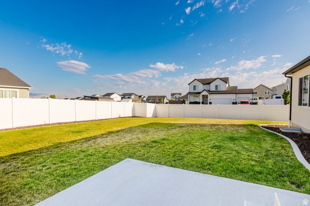 433 North 600 West Smithfield, UT 84335 - Photo 8 of 40 Expansive grass lawn with a white privacy fence