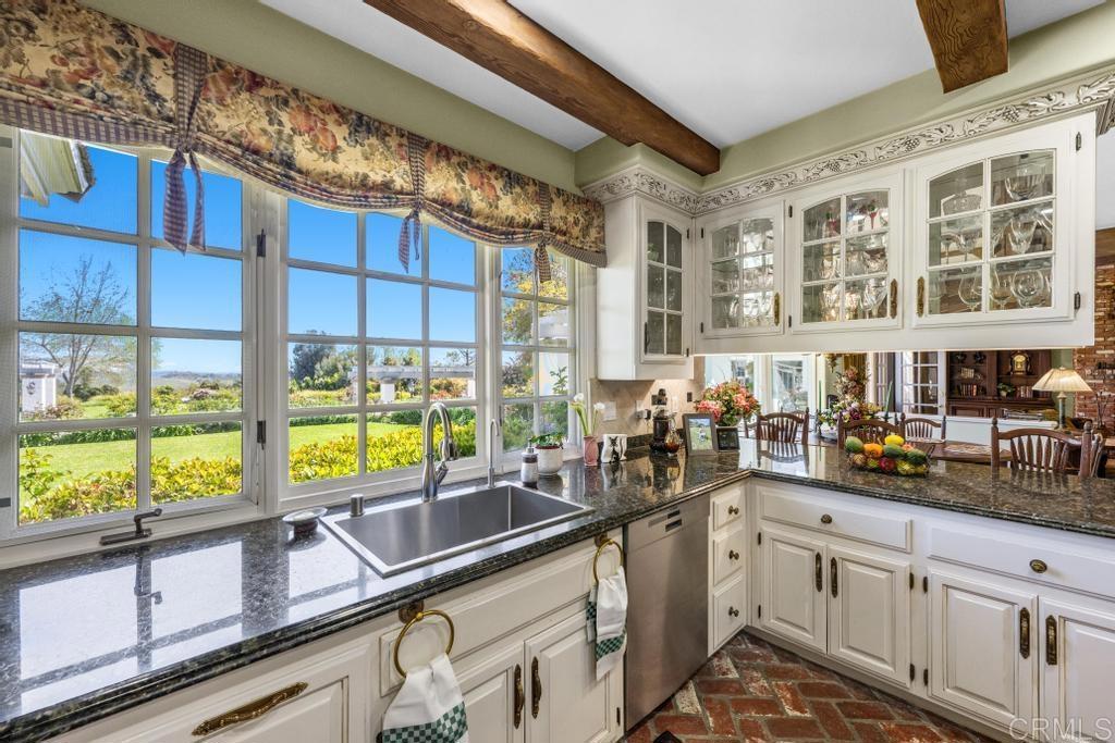 27 Shady Hill Lane Fallbrook, CA 92028 - Photo 13 of 75 a kitchen with a sink and a large window
