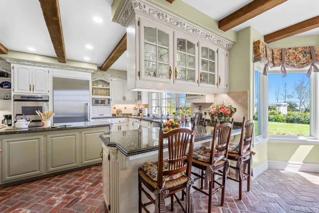 27 Shady Hill Lane Fallbrook, CA 92028 - Photo 9 of 75 a dining hall with furniture and wooden floor