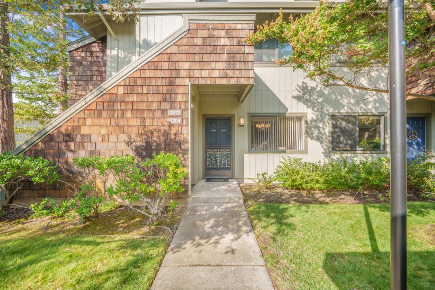 1204 La Terrace Circle San Jose, CA 95123 - Photo 1 of 26 a front view of a house with garden