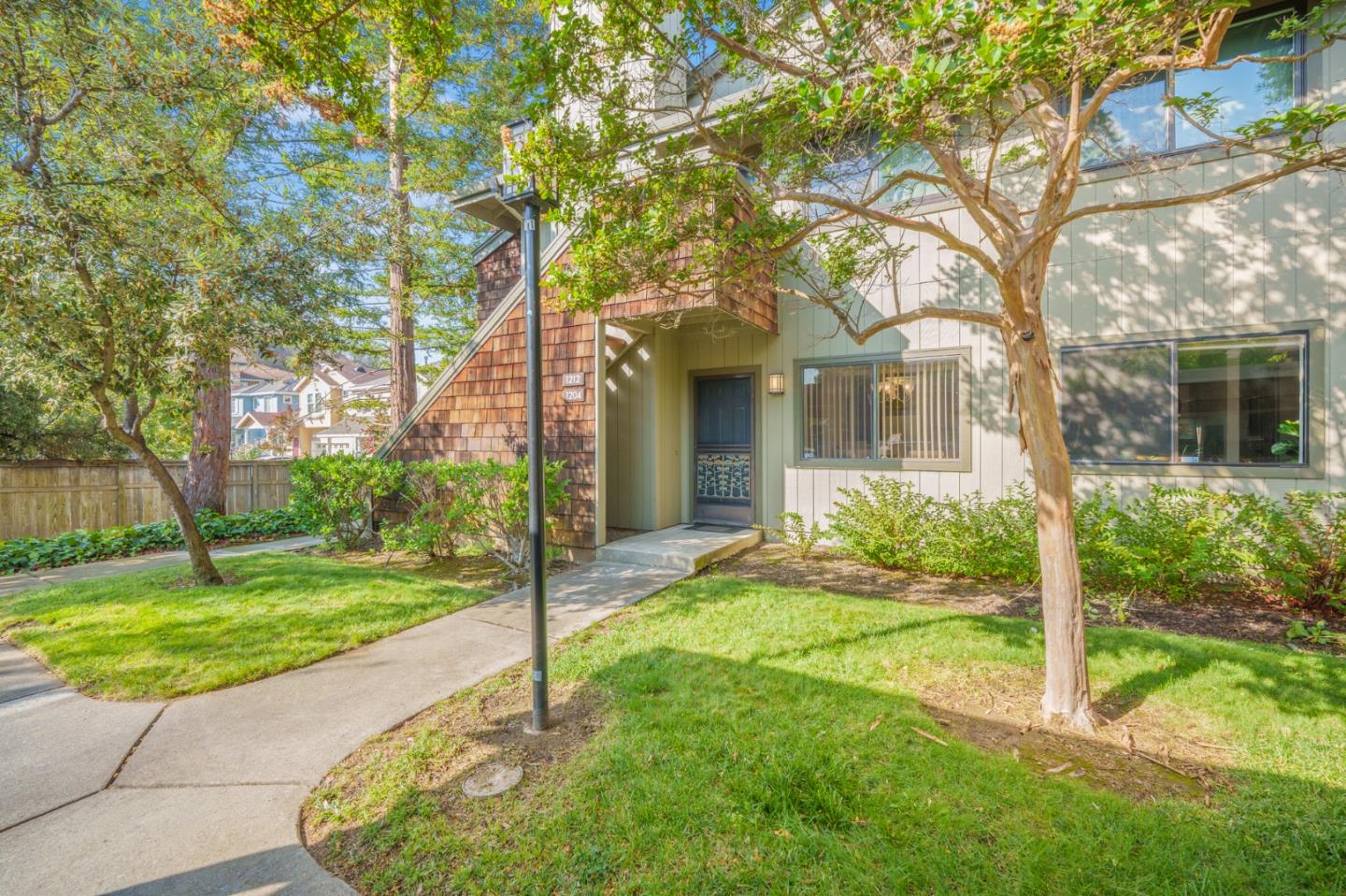 1204 La Terrace Circle San Jose, CA 95123 - Photo 20 of 26 a view of a house with brick walls plants and large tree