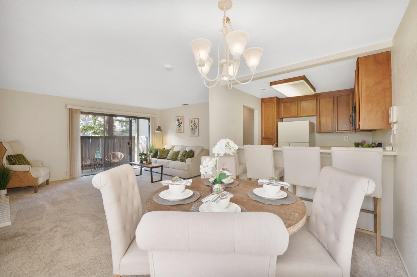 1204 La Terrace Circle San Jose, CA 95123 - Photo 5 of 26 a view of a dining room with furniture wooden floor and chandelier