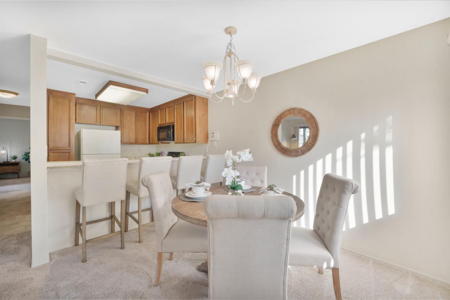 1204 La Terrace Circle San Jose, CA 95123 - Photo 6 of 26 a dining room with wooden floor a chandelier a wooden table and chairs