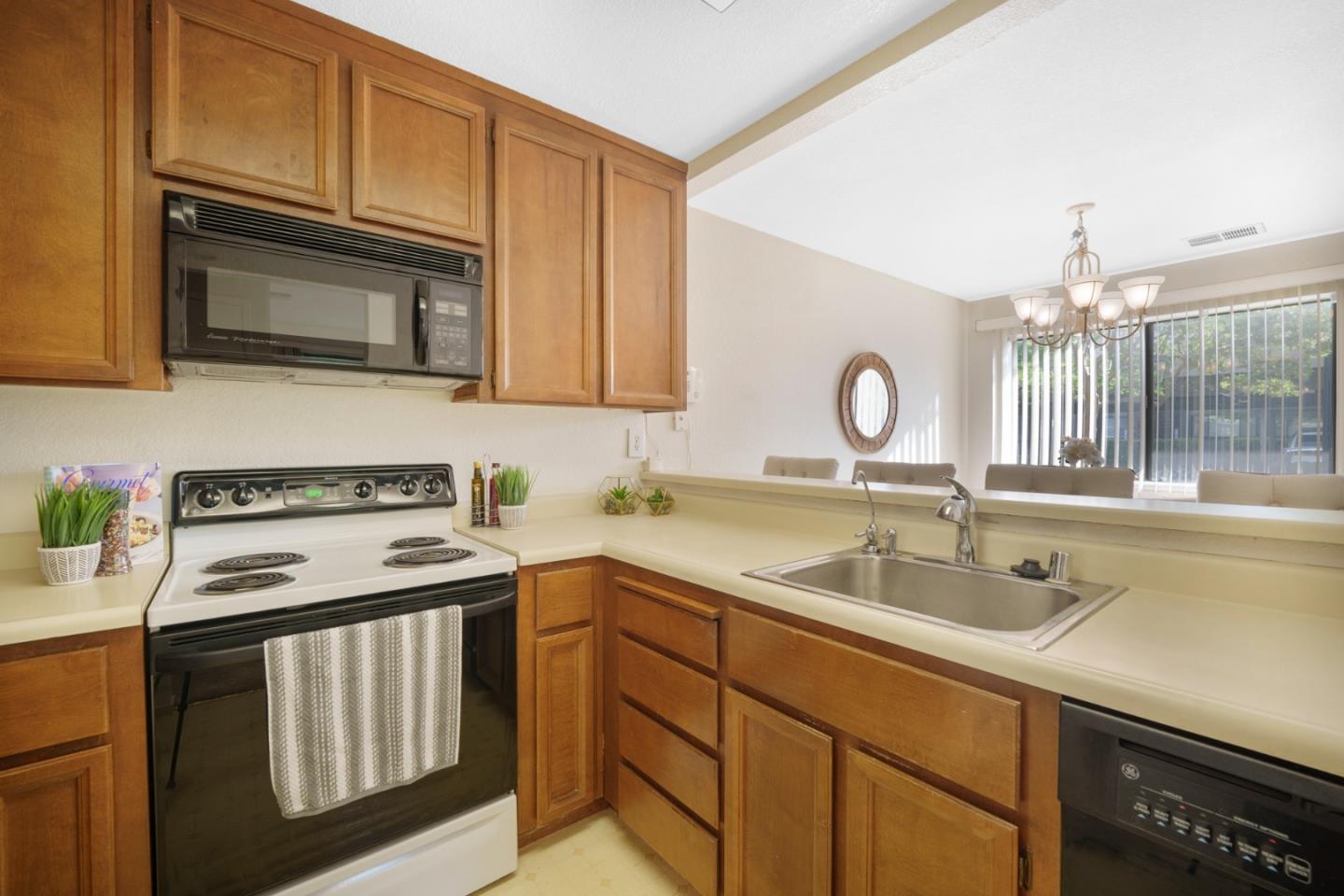 1204 La Terrace Circle San Jose, CA 95123 - Photo 9 of 26 a kitchen with stainless steel appliances granite countertop a sink stove and cabinets