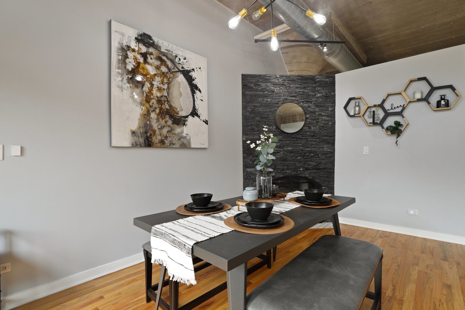 1111 West 15th Street, Unit 113 Chicago, IL 60608 - Photo 11 of 34 a view of a workspace with furniture and wooden floor