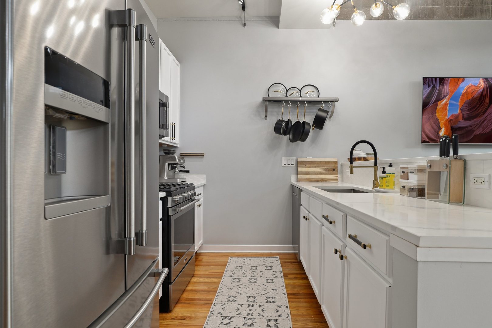1111 West 15th Street, Unit 113 Chicago, IL 60608 - Photo 14 of 34 a kitchen with refrigerator and cabinets