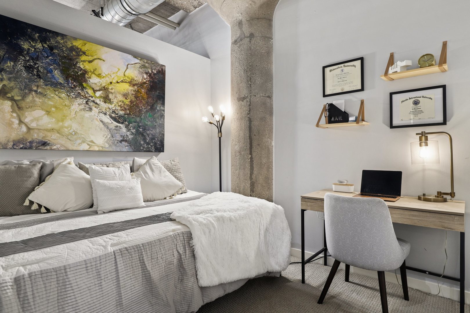 1111 West 15th Street, Unit 113 Chicago, IL 60608 - Photo 19 of 34 a bedroom with a bed and a desk