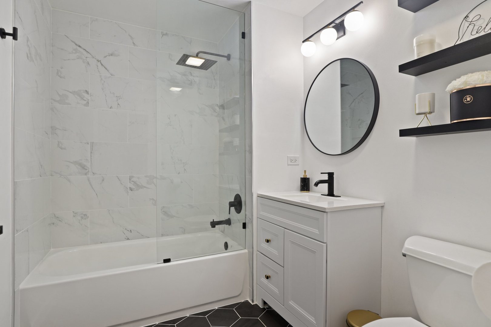 1111 West 15th Street, Unit 113 Chicago, IL 60608 - Photo 20 of 34 a bathroom with a sink a toilet and a mirror