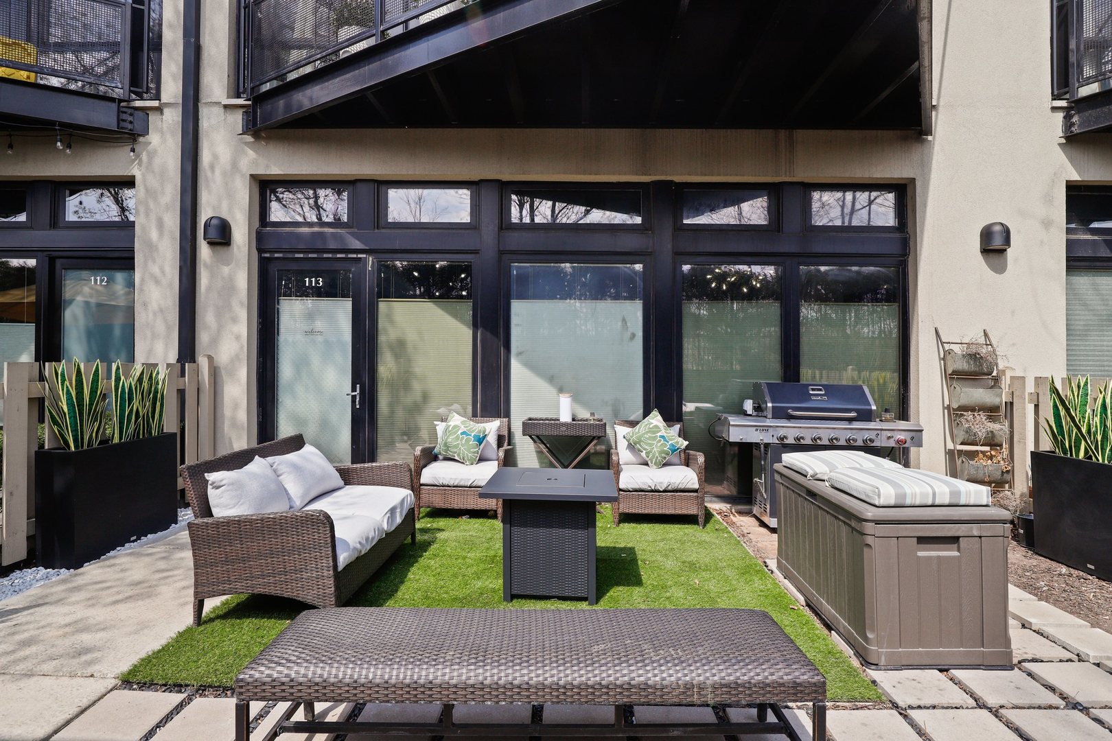 1111 West 15th Street, Unit 113 Chicago, IL 60608 - Photo 23 of 34 a front view of a house with outdoor seating