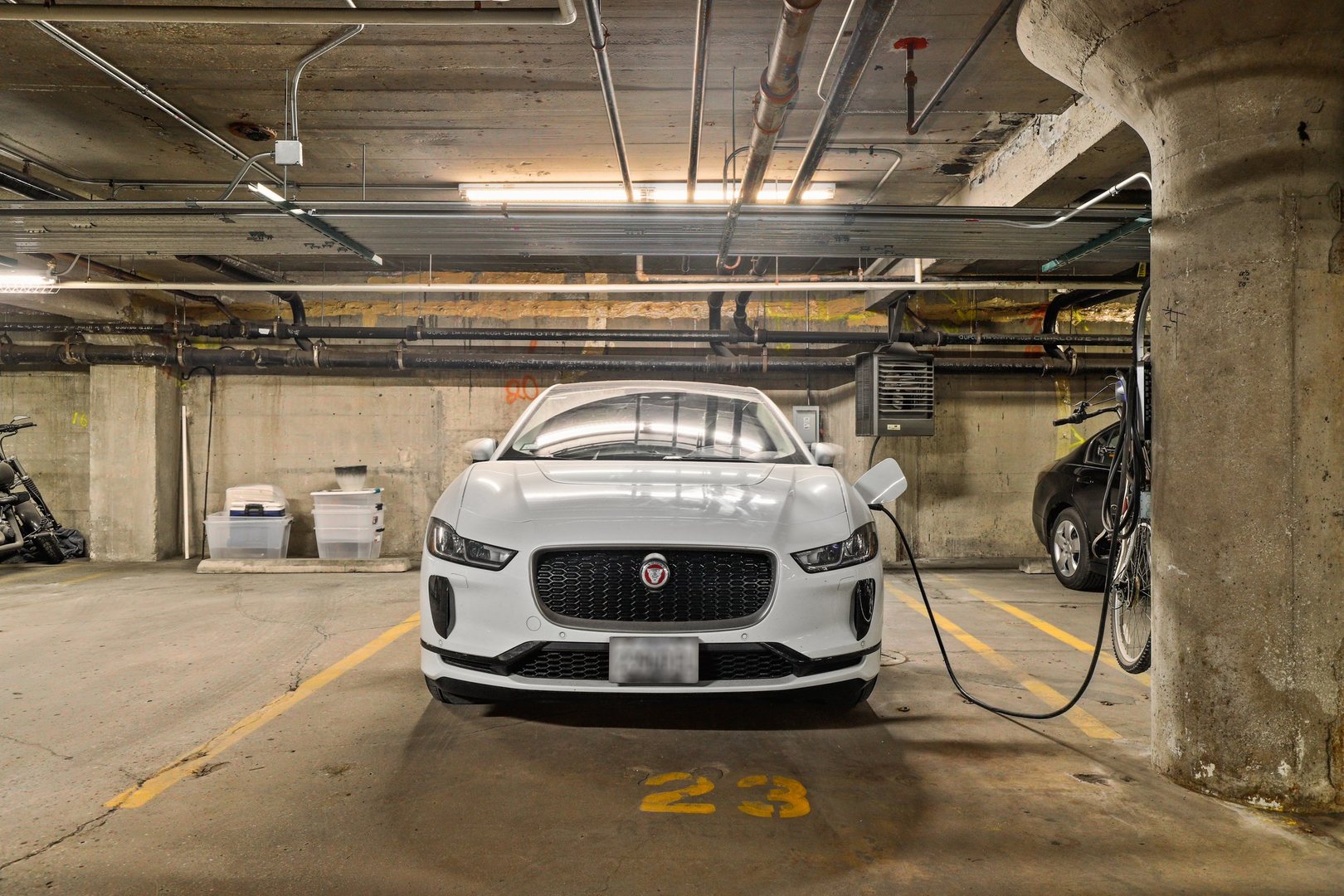 1111 West 15th Street, Unit 113 Chicago, IL 60608 - Photo 24 of 34 a car is parked in a garage