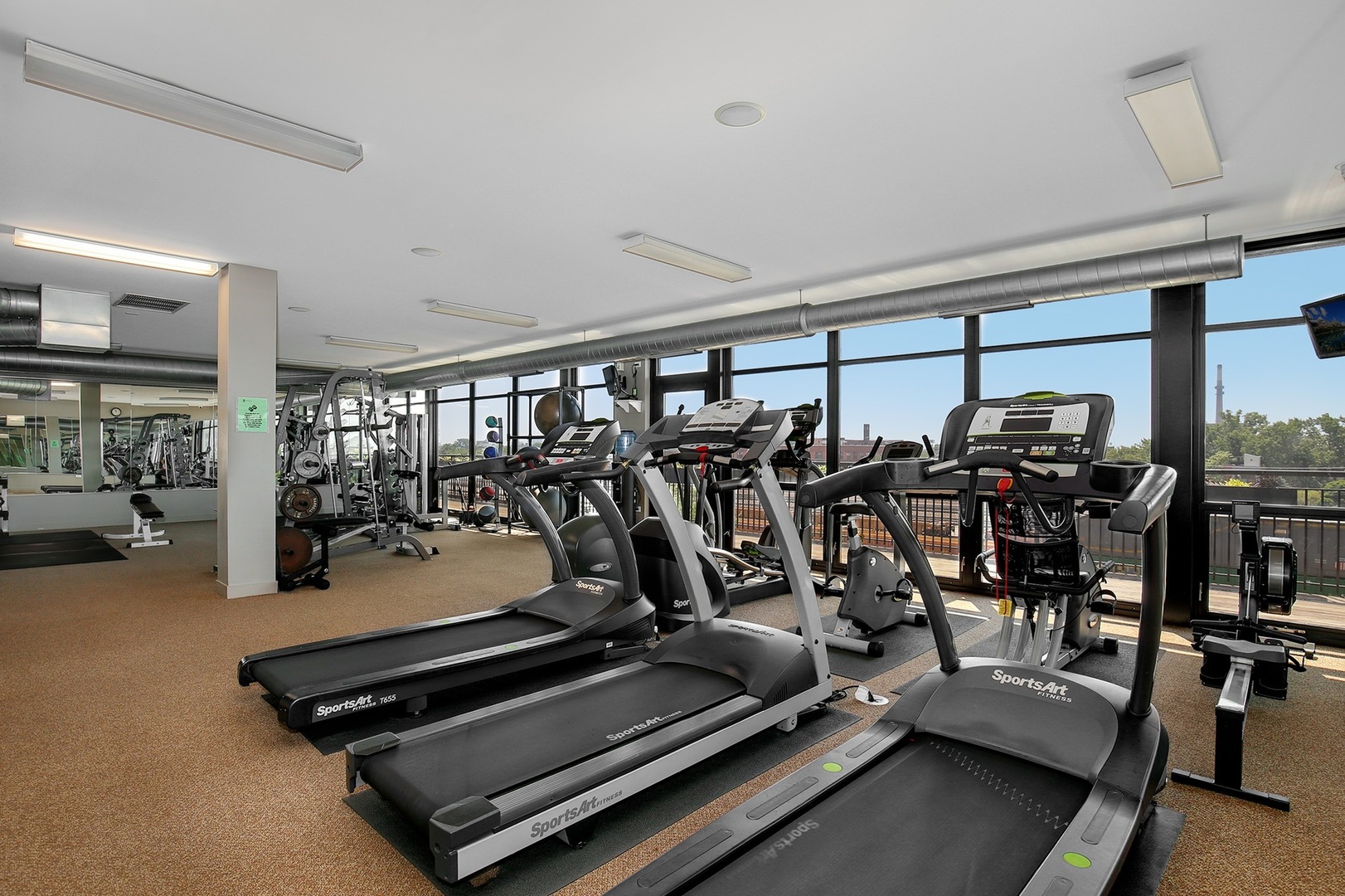 1111 West 15th Street, Unit 113 Chicago, IL 60608 - Photo 27 of 34 a view of a room with gym equipment