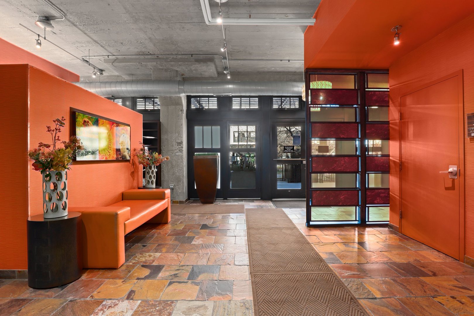 1111 West 15th Street, Unit 113 Chicago, IL 60608 - Photo 30 of 34 a lobby with furniture and window